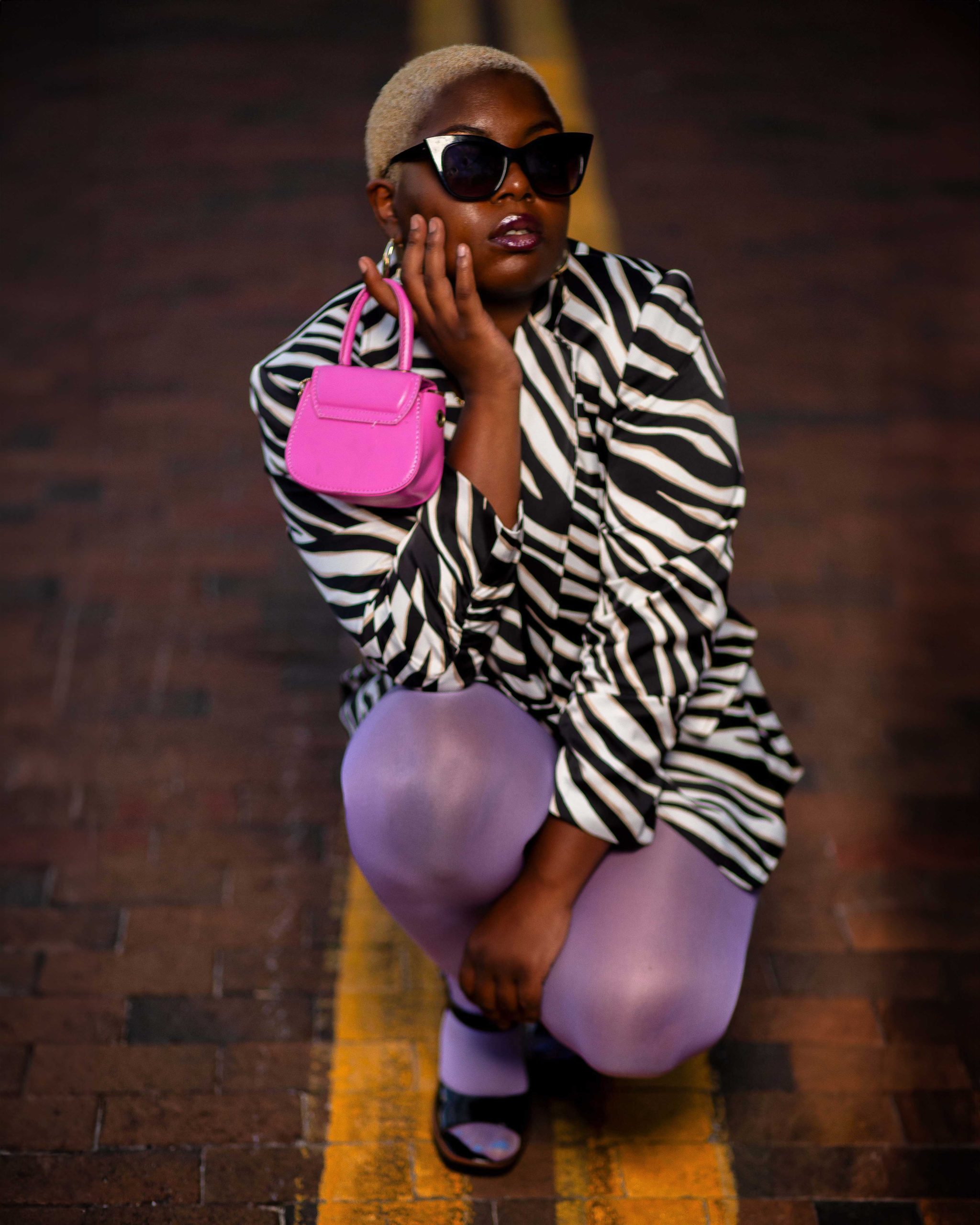 Black woman in a zebra print jacket